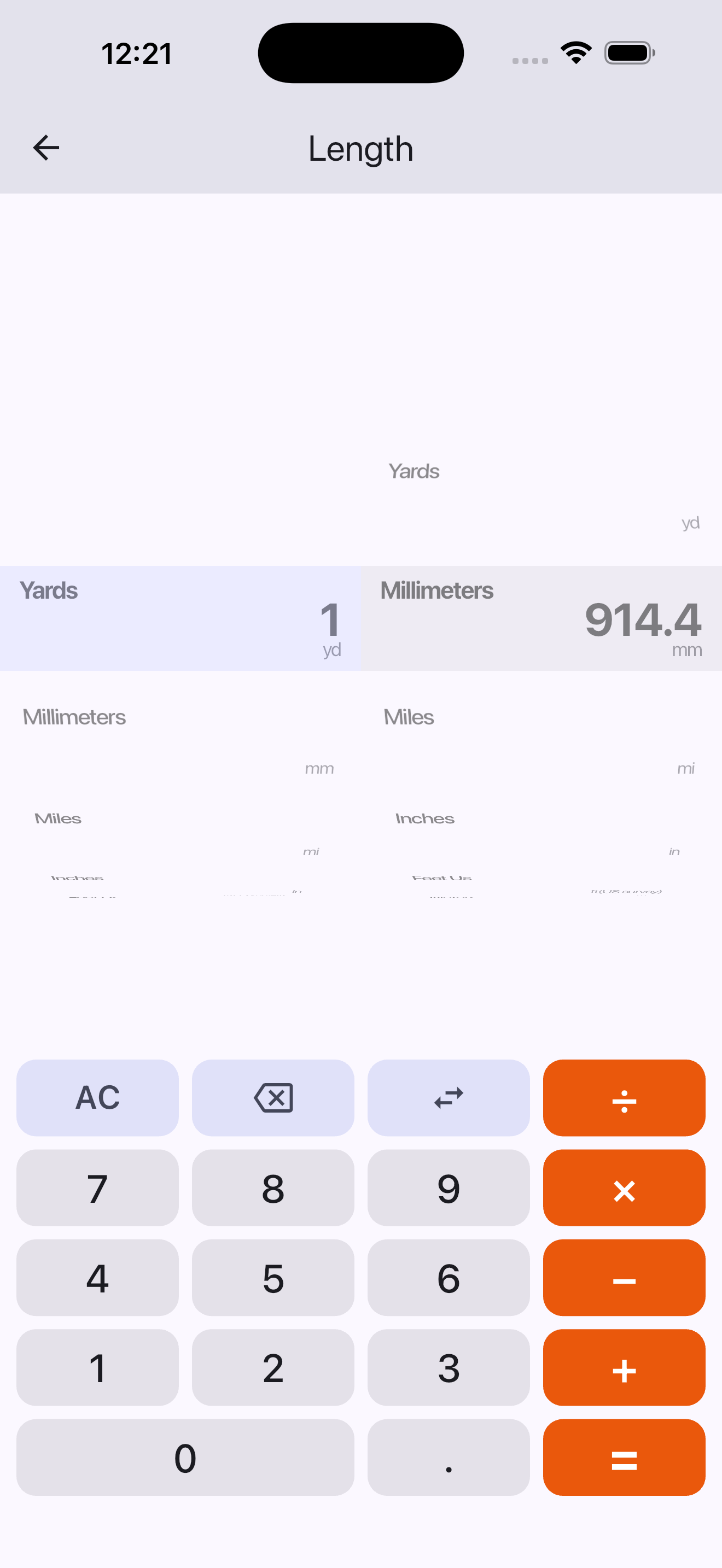 Length converter with two wheels and a calculator keypad